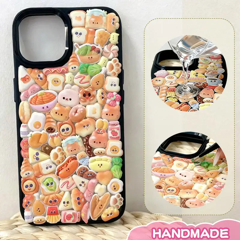 Finished DIY iPhone case with black frame, decorated with dense glossy bread and animal stickers, creating a warm and delicious bakery aesthetic.