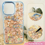 Finished DIY iPhone case with gradient blue frame, decorated with dense glossy capybara stickers, creating a warm and cozy capybara paradise aesthetic.