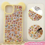 Finished DIY iPhone case with cream yellow bear ear frame, decorated with dense capybara and food stickers, creating a warm cozy capybara paradise aesthetic.