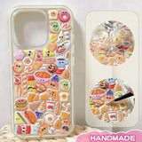 Finished DIY iPhone case with cream-colored frame, decorated with dense glossy cartoon food stickers, creating a playful and delicious aesthetic.
