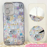 Finished DIY iPhone case with translucent purple frame, decorated with dense dreamy crystal animal stickers, creating a magical pastel aesthetic.
