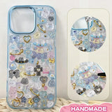 Finished DIY iPhone case with gradient blue frame, decorated with dense dreamy planet and animal stickers, creating a magical celestial aesthetic.