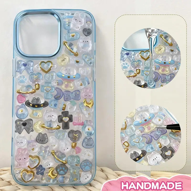 Finished DIY iPhone case with gradient blue frame, decorated with dense dreamy planet and animal stickers, creating a magical celestial aesthetic.