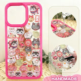 Finished DIY iPhone case with hot pink frame, decorated with dense glossy lucky cat and daruma stickers, creating a festive and lucky aesthetic.