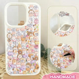 Finished DIY iPhone case with cream frame, decorated with dense mini multi-breed animal stickers, creating a soft and adorable pastel aesthetic.