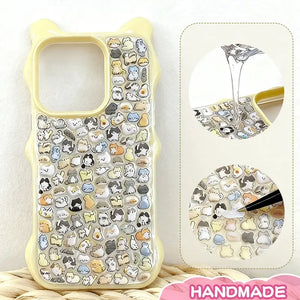 Finished DIY iPhone case with cream yellow bear ear frame, decorated with dense mini multi-breed animal stickers, creating a soft and adorable kawaii aesthetic.
