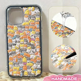 Finished DIY clear iPhone case decorated with dense mini orange and black cat stickers, creating a cute and cozy cat paradise aesthetic.