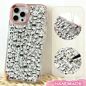 Finished DIY clear iPhone case with pink gradient frame, decorated with dense mini panda stickers, featuring a cute minimalist black and white panda aesthetic.