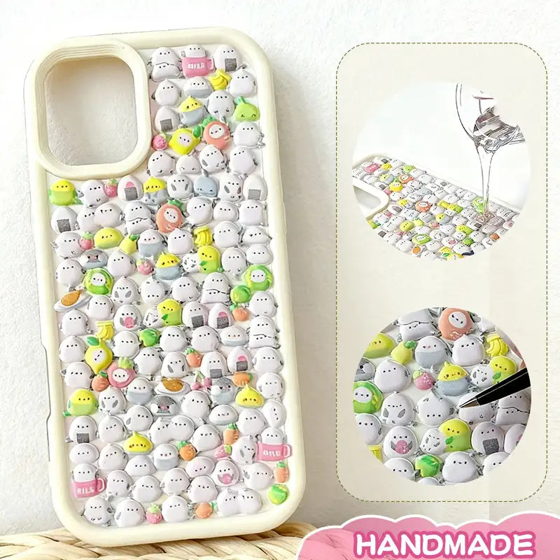 Finished DIY iPhone case with cream frame, decorated with dense mini positive energy penguin and sea animal stickers, featuring a soft pastel kawaii aesthetic.