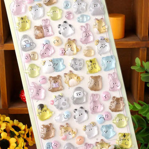 Close-up of 3D crystal clear forest pet stickers with adorable bear, rabbit, and tiger designs, featuring iridescent and glitter effects, self-adhesive PVC epoxy stickers
