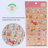 Product info sheet for pink "Fortune Cat" 3D stickers, showing material (PVC/epoxy resin), packaging size, and detailed sticker designs.