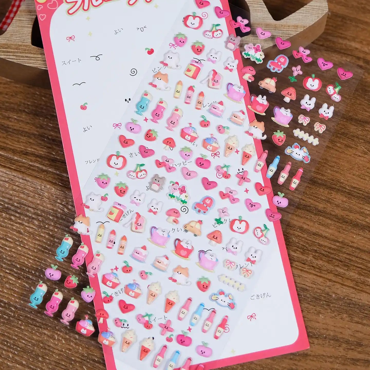 Close-up of 3D puffy stickers featuring adorable fruit, ice cream, and heart motifs, self-adhesive PVC epoxy stickers perfect for planners and phone case decoration
