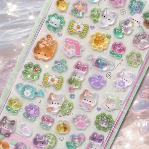 Close-up of 3D crystal clear garden cat stickers with adorable cat and flower designs, featuring iridescent and glitter effects, self-adhesive PVC epoxy stickers
