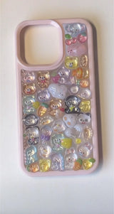 Final look of a handmade DIY phone case with 3D resin zoo animals on a transparent back with a stylish pink protective rim.