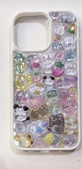 Finished handmade DIY phone case covered in colorful 3D resin animal charms including pandas and rabbits, kawaii aesthetic.
