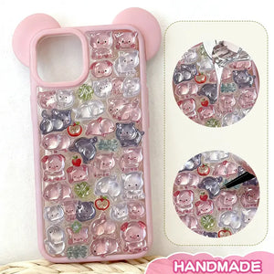 Finished display of handmade DIY phone case with full pink pig print, pink ear frame, and cute mini pig patterns