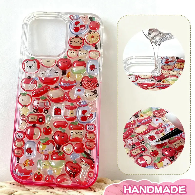 Finished display of handmade DIY phone case with full red apple print, red frame, and cute apple & cartoon character patterns