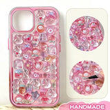 Finished display of handmade DIY phone case decorated with pink rabbit and cute accessories, featuring iridescent crystal effects and pink border
