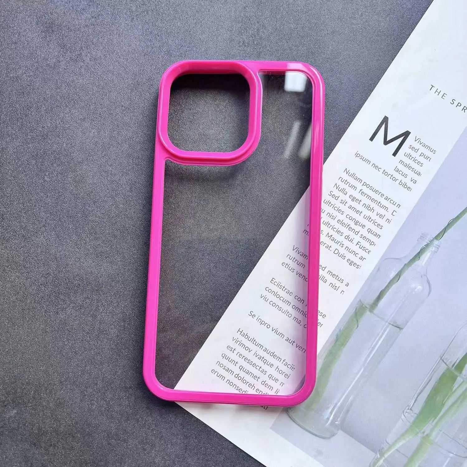 Clear DIY phone case for iPhone with bright hot pink protective frame and transparent back panel, featuring raised camera protection, ideal for sticker decoration.