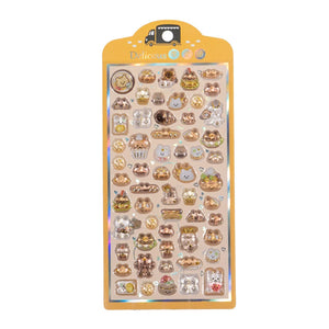 A retail sheet of premium Bonbon Drop Seal 3D glossy stickers with a delicious snack theme, featuring cute cartoon cats shaped like bread, donuts, and cupcakes.