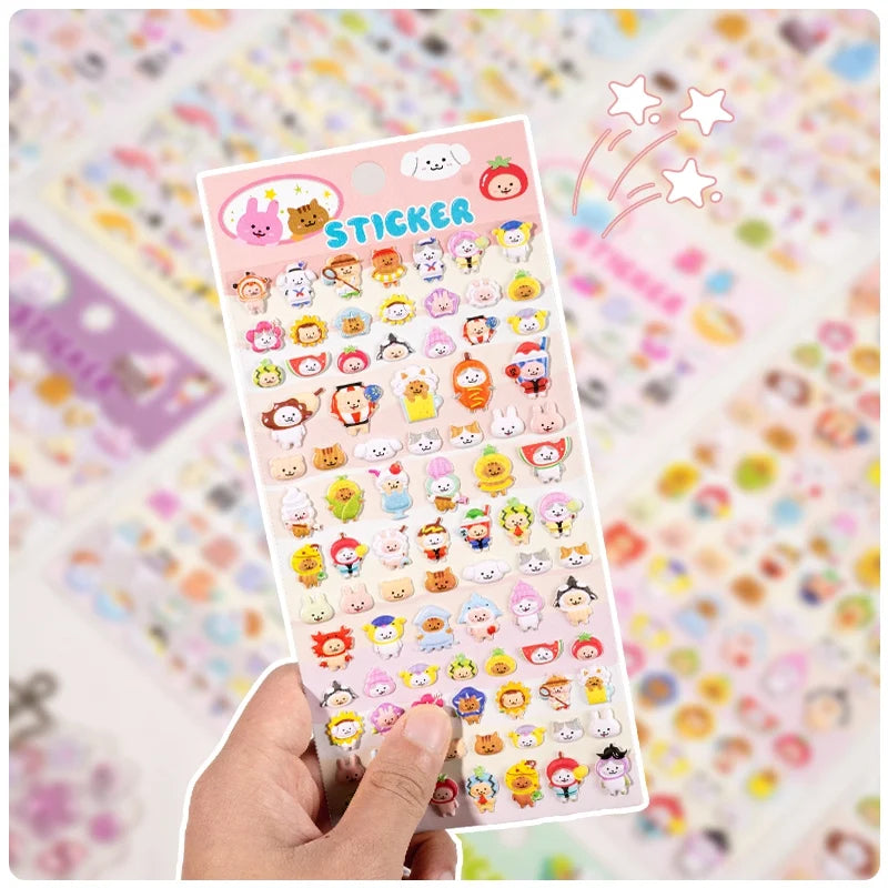 Handheld display of 3D puffy sticker sheet with cute cartoon animals in fruit costumes, self-adhesive PVC epoxy stickers for DIY crafts and planner decoration
