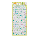 A sheet of Japanese kawaii mini puffy 3D stickers with a yellow-green spring picnic theme, featuring tiny dinosaurs, trees, and cups.