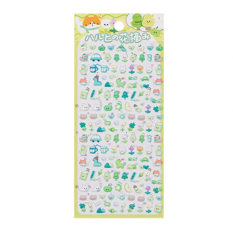 A sheet of Japanese kawaii mini puffy 3D stickers with a yellow-green spring picnic theme, featuring tiny dinosaurs, trees, and cups.