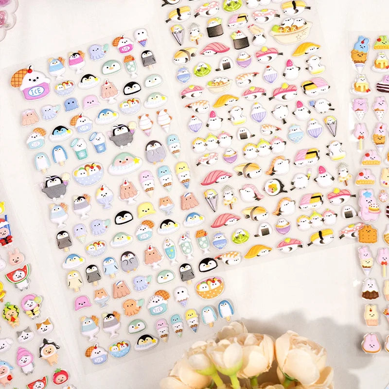 Flat lay of 3D puffy stickers with cute cartoon penguins and seals, self-adhesive epoxy PVC stickers for phone case and planner decoration
