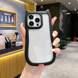 A unique hybrid protective phone case in matte black featuring a custom cat-ear shape top border and a crystal clear transparent back panel, shown held in hand.