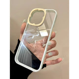 A premium hybrid protective phone case featuring a soft mint green bumper frame, a unique contrasting light yellow camera protection rim embossed with star details, and a crystal clear back panel.