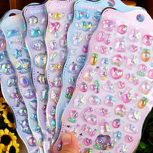 Collection of 3D crystal puffy "BONBON DROP" sticker sheets with adorable iridescent pet designs, in blue and pink pastel color schemes