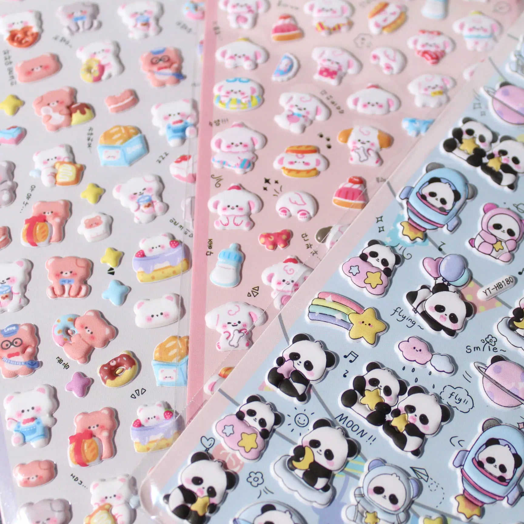 Close-up of 3D puffy stickers featuring adorable puppy, dessert, and space panda designs, self-adhesive PVC epoxy stickers

