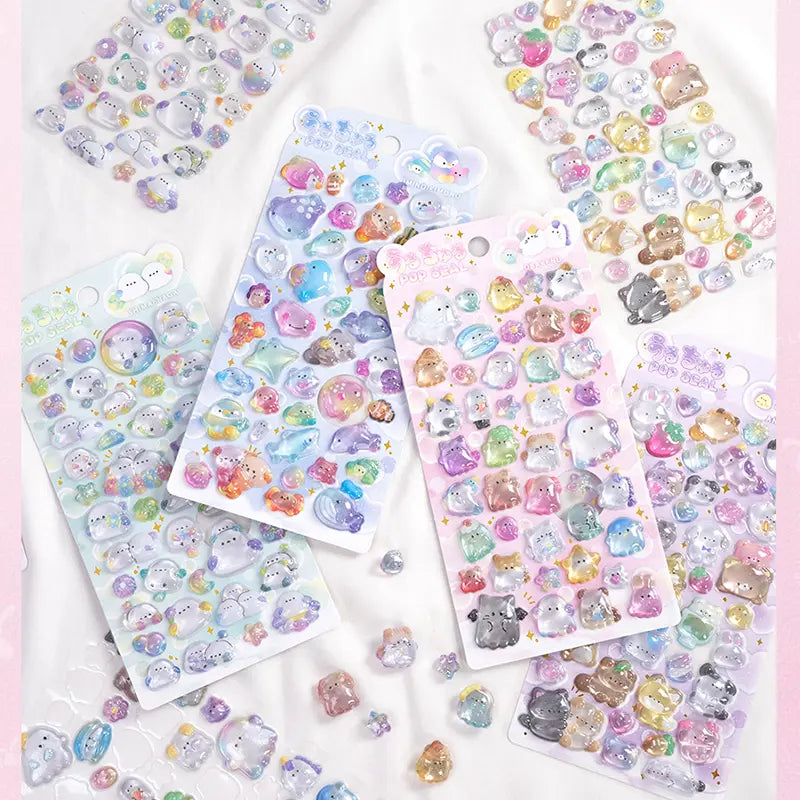 Collection of 3D crystal puffy sticker sheets with adorable pet designs (ghost, animal, bakery), in pastel purple, pink, and blue color schemes