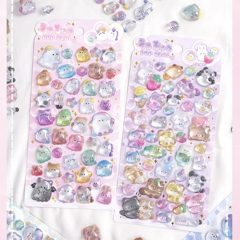 Collection of 3D crystal puffy sticker sheets with adorable ghost, animal, and bakery pet designs, in pastel pink, purple, and blue color schemes
