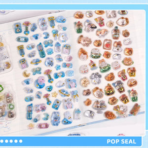 Decorative display of 3D crystal clear stickers with cute ocean animal and pet designs, used for journal decoration

