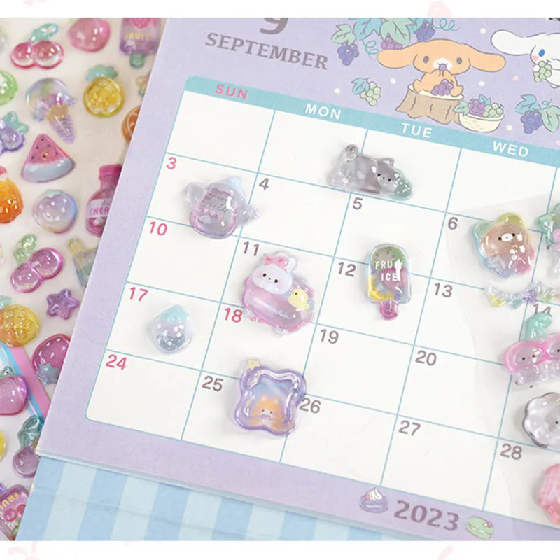 Decorative display of 3D pet crystal stickers used for planner and calendar DIY, featuring adorable animal and sweet treat designs with holographic effects
