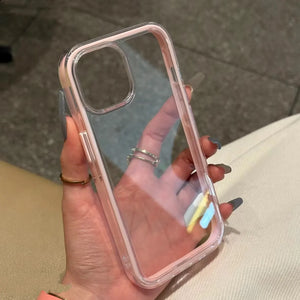 Clear DIY phone case for iPhone with soft pink protective frame and transparent back panel, featuring raised camera protection, ready for sticker decoration.