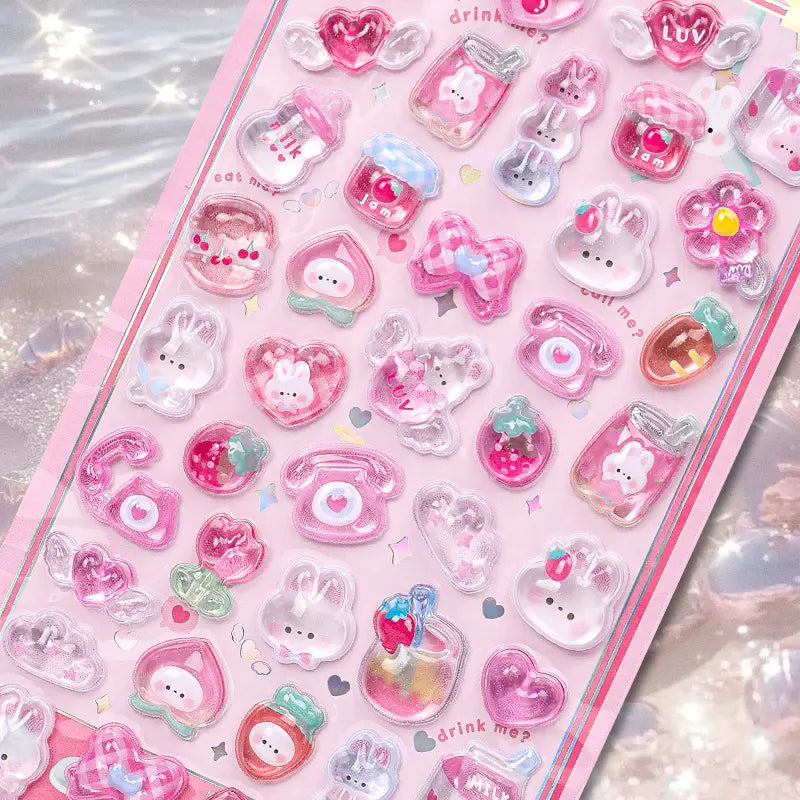 Close-up of 3D crystal clear pink pet stickers with adorable rabbit, heart, and drink bottle designs, featuring iridescent and glitter effects, self-adhesive PVC epoxy stickers