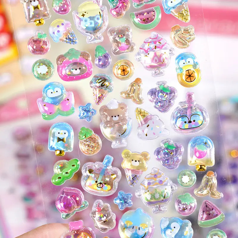 Close-up of 3D crystal clear stickers with adorable rainbow dessert, pet, and fruit designs, featuring iridescent glitter and gold foil effects, self-adhesive PVC epoxy stickers