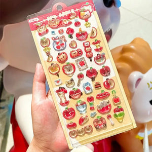 Cute kawaii sticker sheet with glossy jelly-style red apple and cat character designs, perfect for DIY phone case decoration.