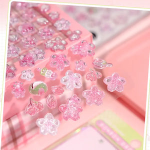 Close-up of 3D crystal clear sakura stickers with adorable cherry blossom and fruit designs, featuring iridescent and glitter effects, self-adhesive PVC epoxy stickers