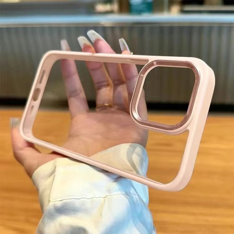 A premium protective phone case in soft sand pink featuring a raised rose gold metallic camera bezel and a crystal clear transparent acrylic back panel, shown held in hand.