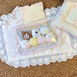 Seven small pastel animal and swirl shapes displayed together in a clear pack.