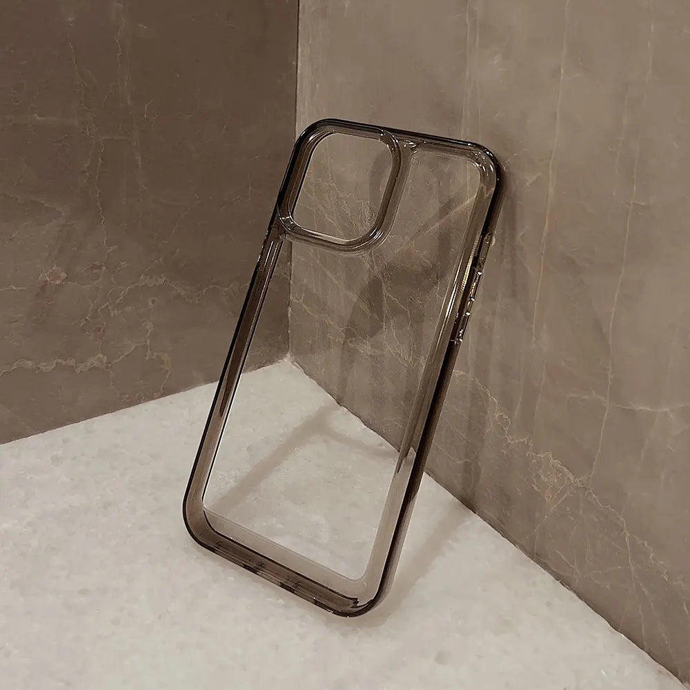 Clear DIY phone case for iPhone with smoky black protective frame and transparent back panel, featuring raised camera protection, ready for sticker decoration.