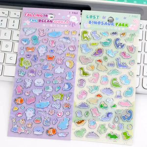 Transparent silver edge 3D bubble sticker sheet with colorful dinosaur patterns, green background, PVC self-adhesive, size 200×95mm