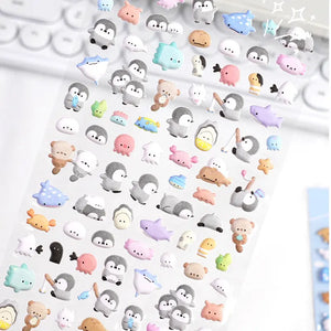 Close-up of Puchipuni Life Seal penguin & sea creature stickers, showing soft plush texture	