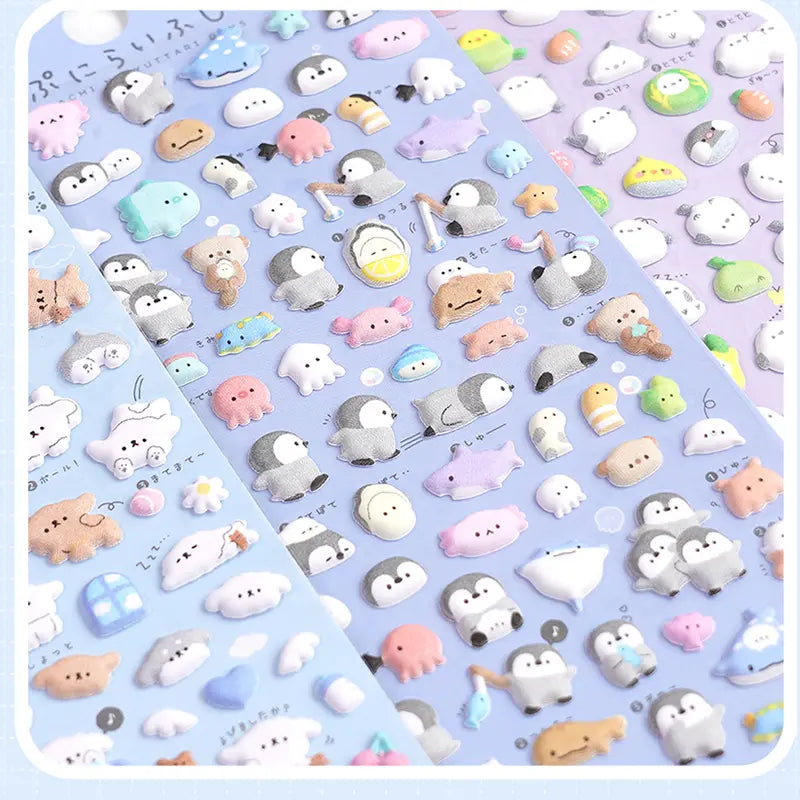Wholesale display of multiple Puchipuni Life Seal sticker sheets, featuring penguin, octopus, whale	